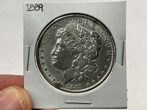 lot 28 image: 1889 Morgan Silver Dollar