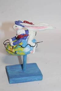 lot 146 image: Whimsical Hand-Painted Rabbit Figurine on Blue Stand
