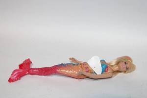 lot 282 image: Barbie Mermaid Doll with Colorful Tail and Decor