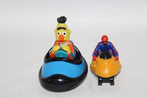 lot 285 image: Set of 2 Toy Figures - Bert in Bumper Car & Snowmobile Racer