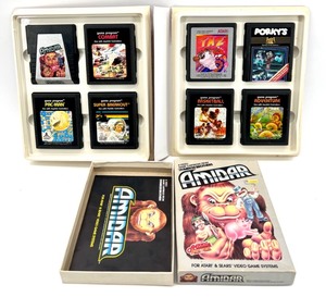 lot 406 image: Atari Collectible Binder with 8 Game Cartridges Including Amidar and Pac-Man
