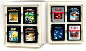 lot 408 image: Set of 8 Atari 2600 Game Cartridges with Original Storage Binder