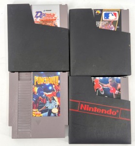 lot 428 image: Set of 4 NES Game Cartridges with 3 Sleeves