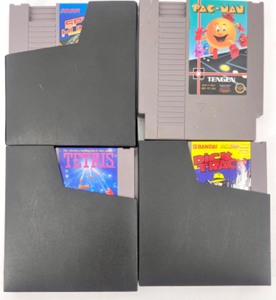 Lot of 4 Classic Nintendo NES Game Cartridges with 2 Sleeves Including Pac-Man, Tetris, Spy Hunter & Dick Tracy