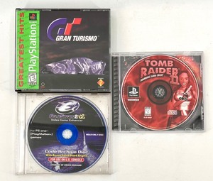 lot 603 image: Collection of 3 PlayStation Games Gran Turismo, Tomb Raider II, and GameShark v2
