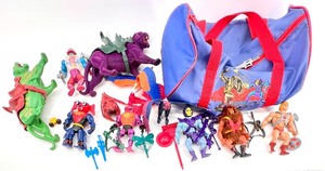 lot 622 image: Amazing Collection of 10 Vintage Masters of the Universe Action Figures with Matching Duffel Bag and Accessories