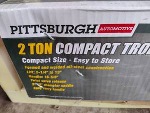 lot 202 image: Pittsburgh Compact 2 Ton Trolley Jack New
