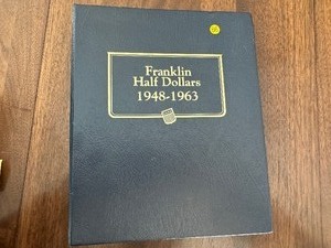 lot 86 image: Whitman Classic Coin Album For Franklin Half Dollars - $25 Dollar Value