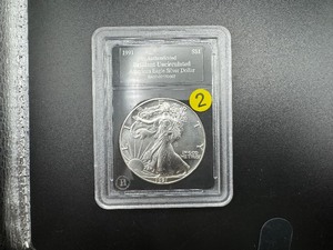 lot 2 image: 1991 1 Oz. Silver American Eagle Authenticated BU