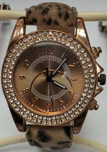 lot 22 image: Animal Print Watch with a Gold Dial Framed in White Crystals