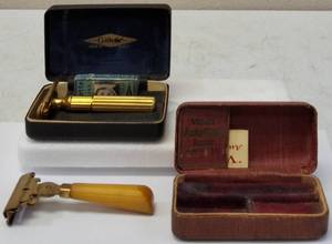 lot 41 image: Vintage Razors (1)Gillette with Matching Box (1) Schick Razor with Mustard Handle (1) Valet Auto Strop Razor Box