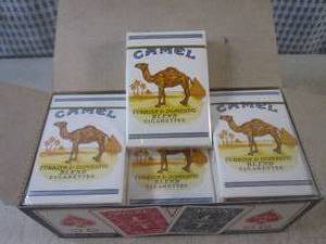 lot 147 image: (EC1) 12 New Decks Camel Cigarettes...