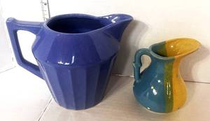 lot 9 image: 2 Vintage Pitchers. Blue Ribbed and Small Blue and Yellow
