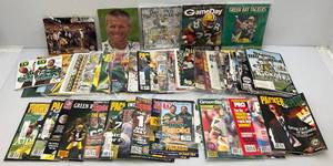 lot 18 image: Misc. Brett Farve Autographed Items (Most With COA), Green Bay Packers Collectible Magazines & More