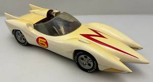 lot 35 image: Vintage Speed Racer Toy Car With Action Figure (White Is Yellowed)
