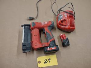 lot 29 image: Milwaukee Cordless 23 ga. Trim Nail...
