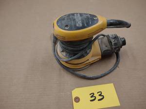 lot 33 image: Dewalt Palm Sander...