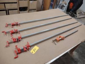 lot 50 image: (4) 5 & (1) 2 Pipe Clamps...