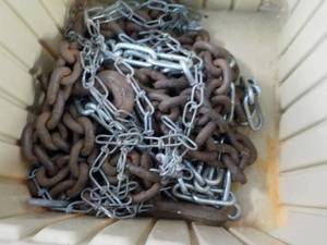 lot 102 image: Dolly and Chains in a plastic baske...