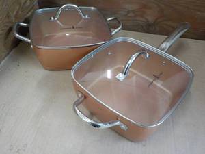 lot 134 image: 2 Copper Pans and Covers unused...