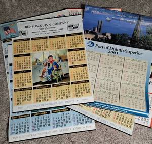 lot 36 image: 9 - Vintage Wall Calendars (7-Benson Quinn, 1- Duluth, 1- Great Northern)