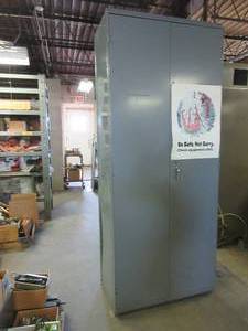 lot 555 image: GRAY METAL 2 DOOR CABINET