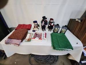 lot 104 image: Collection of Holiday Decor Items Including Snowman Figures and Table Linens