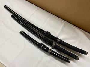 lot 16K image: Three-Piece Japanese Sword Set with Intricate Guard Designs