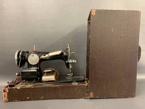 lot 62V image: Vintage Electric Sewing Machine with Case