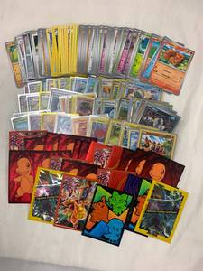lot 17J image: Pokemon Trading Cards w Holographics & Some Sleeves