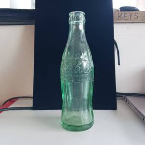 lot 35 image: 1950s Vintage Embossed Coke bottle from Milaca, MN