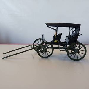 lot 44 image: John Deere die cast buggy - no horse, though.