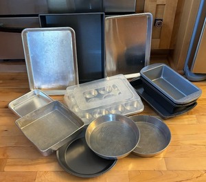 lot 126 image: Cooking and Baking Grouping including Cake Pans, Muffin Tin, Bread Pans, Pie Tins and More by Farberware, Nordic Ware, Wilton and More