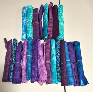 lot 30 image: Colorful Fabric Remnant Rolls