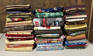 lot 82 image: Three Stacks of Fabric