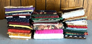 lot 150 image: Three Fantastic Stacks of Fabric