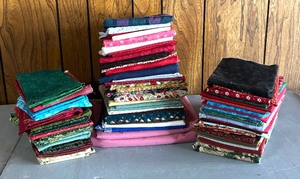 lot 180 image: Three Stacks of Fabric