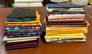 lot 251 image: Two Stacks of Awesome Fabric