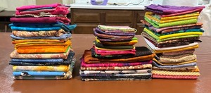 lot 277 image: Three Stacks of Fun Fabric