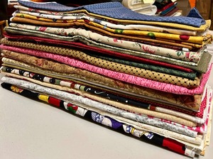 lot 343 image: Yardage of Fabric in Patterns and Solids