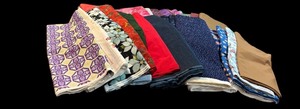 lot 392 image: Lot of Large Fabric Remnants in a  Variety of Patterns