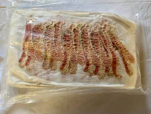 lot 103 image: 3.75lbs Pre Cooked Bacon-12 slices per sheet-25 sheets