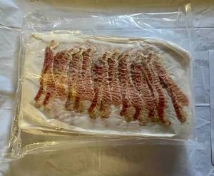 lot 105 image: 3.75lbs Pre Cooked Bacon-12 slices per sheet-25 sheets