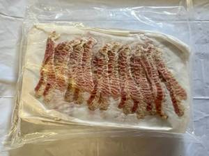 lot 101 image: 3.75lbs Pre Cooked Bacon-12 slices per sheet-25 sheets