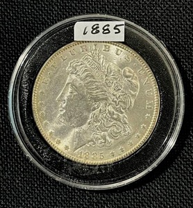 lot 16 image: 1885-P Morgan Silver Dollar (Sealed) AU