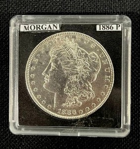 lot 18 image: 1886-P Morgan Silver Dollar (Sealed) AU
