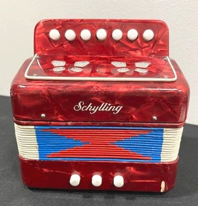 lot 108 image: Vintage Schylling The Little Red Accordion Toy Player (7 x 7 Collapsed)