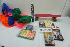 lot 137 image: No Sale Lot VHS, games, skateboard, pool floatie