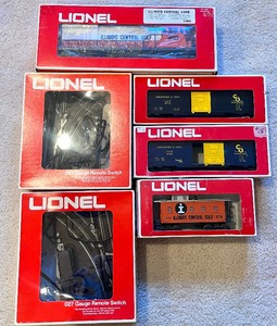 lot 24 image: Lionel Box Cars & Switches including 027 Lionel Gauge Remote Switch