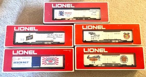 lot 27 image: Five Lionel Red Box Freight Train Box Cars including Lionel Beechnut Box Car  6-7703